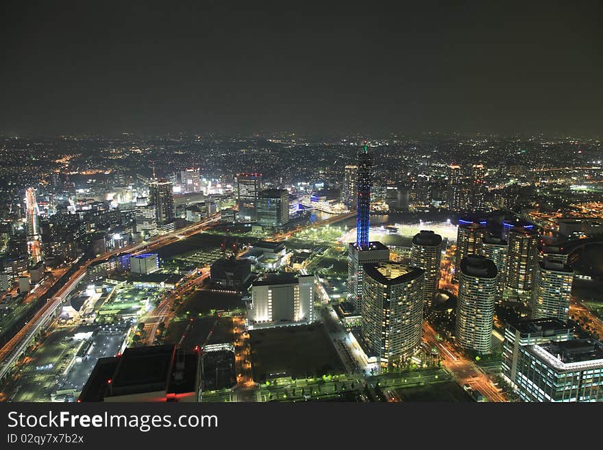 Osaka streets and skyscrapers at night from high above. Osaka streets and skyscrapers at night from high above