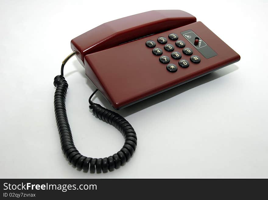 Old fashion phone on plain background