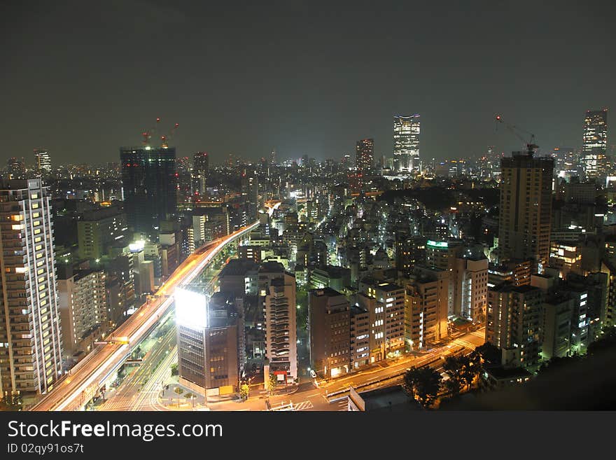 Osaka streets and skyscrapers at night from high above. Osaka streets and skyscrapers at night from high above