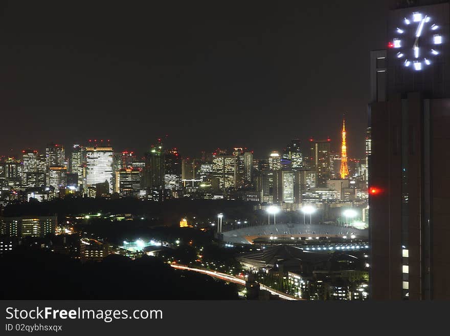 Tokyo streets, stadion and skyscrapers at night from high above. Tokyo streets, stadion and skyscrapers at night from high above