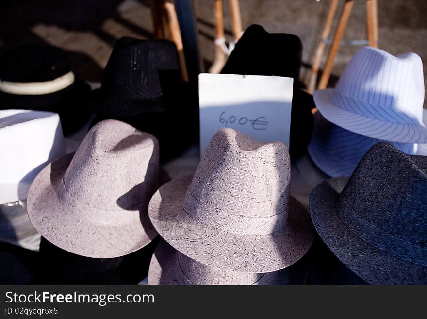 Male hats different colors being sold on the streets. Male hats different colors being sold on the streets