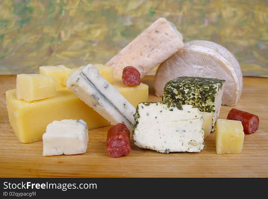 Cheese antipasto varieties on wooden chopping board