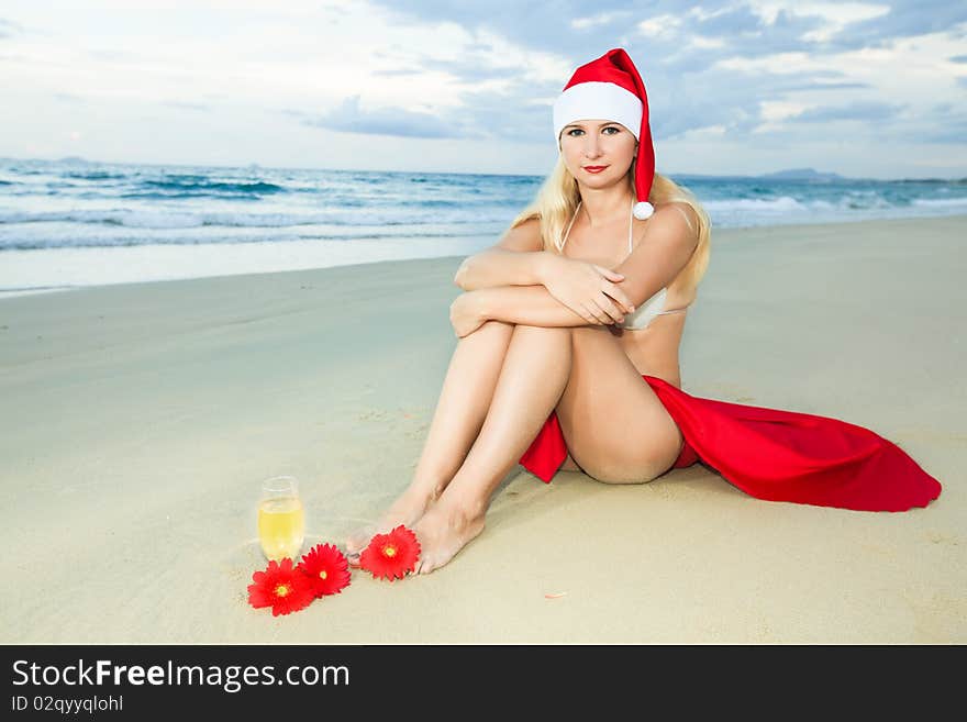 Miss Santa celebrates Christmas at the tropical beach. Miss Santa celebrates Christmas at the tropical beach