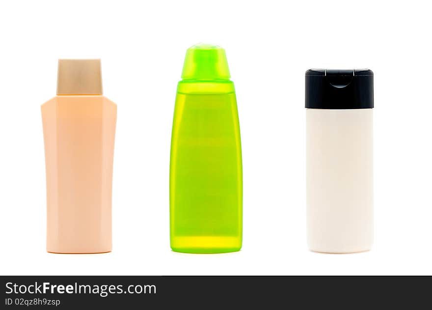 Three blank cosmetic bottles isolated on a white background. Three blank cosmetic bottles isolated on a white background