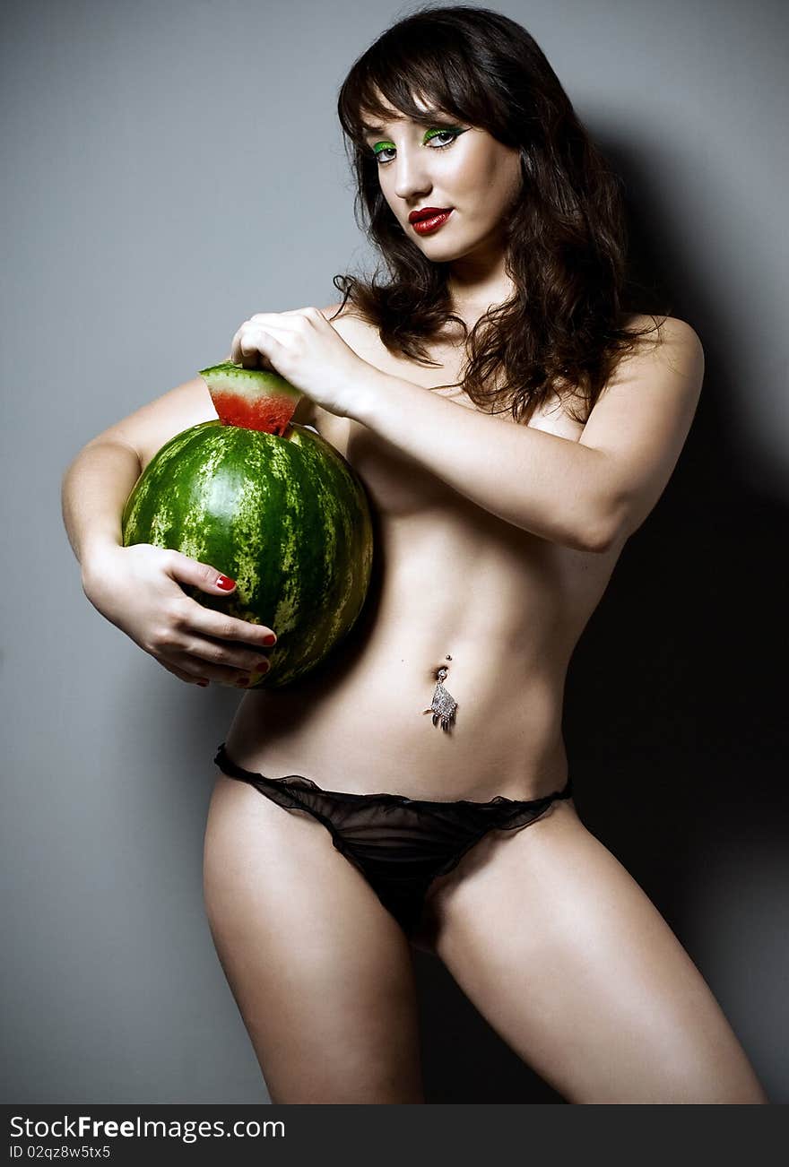 Girl with watermelon in studio