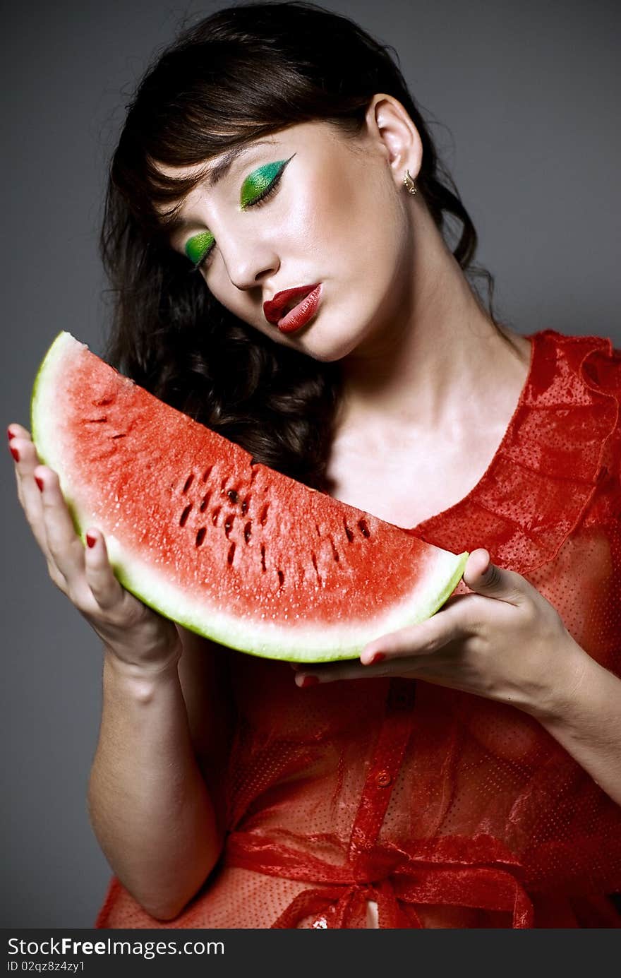 Girl with watermelon in studio