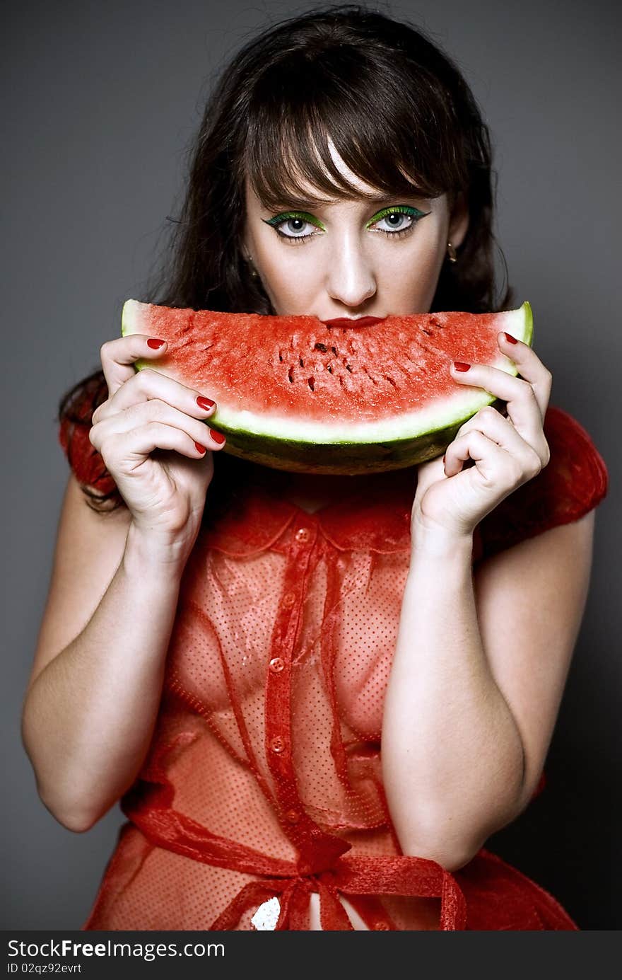 Girl with watermelon in studio