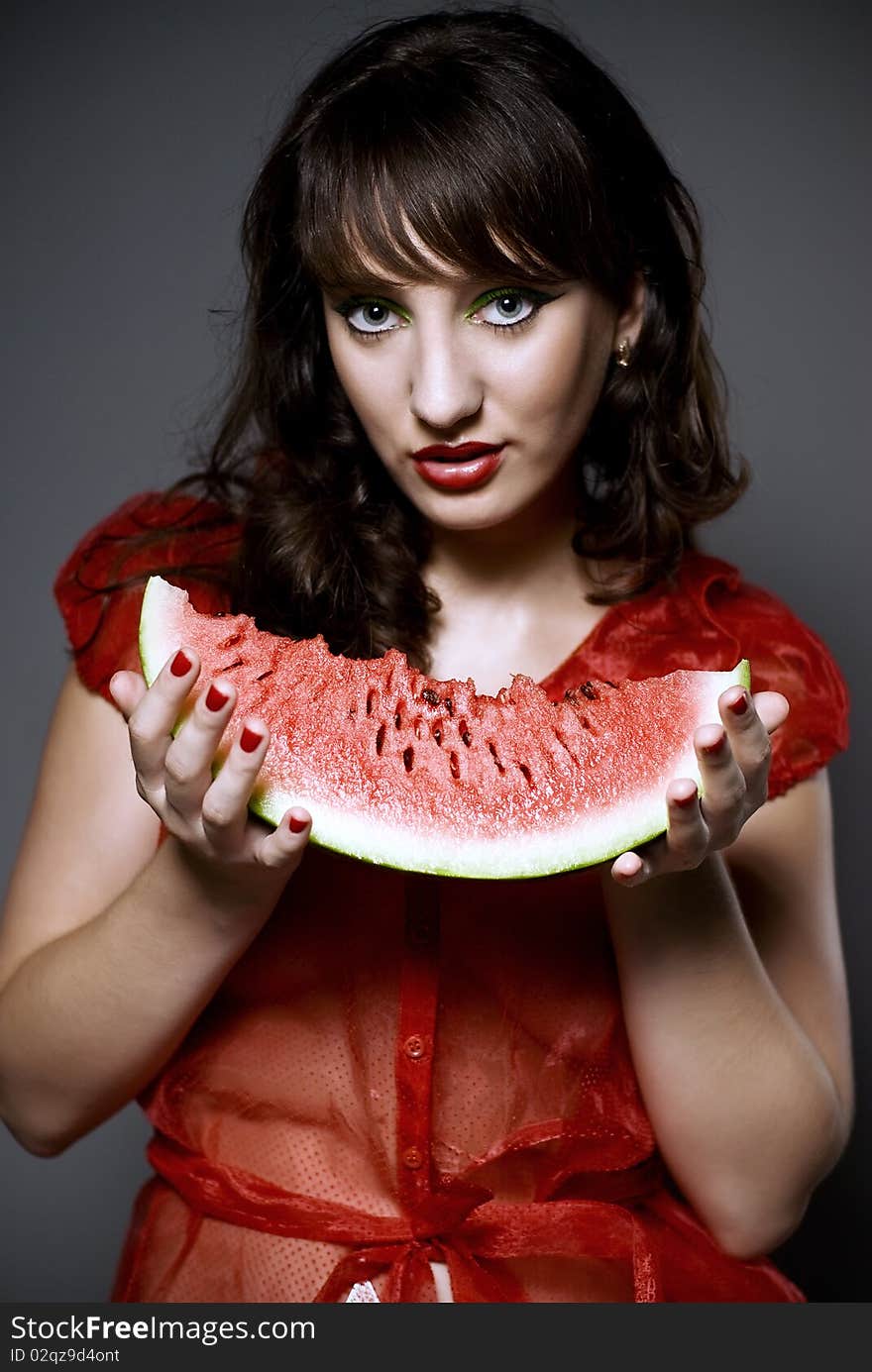 Girl with watermelon in studio