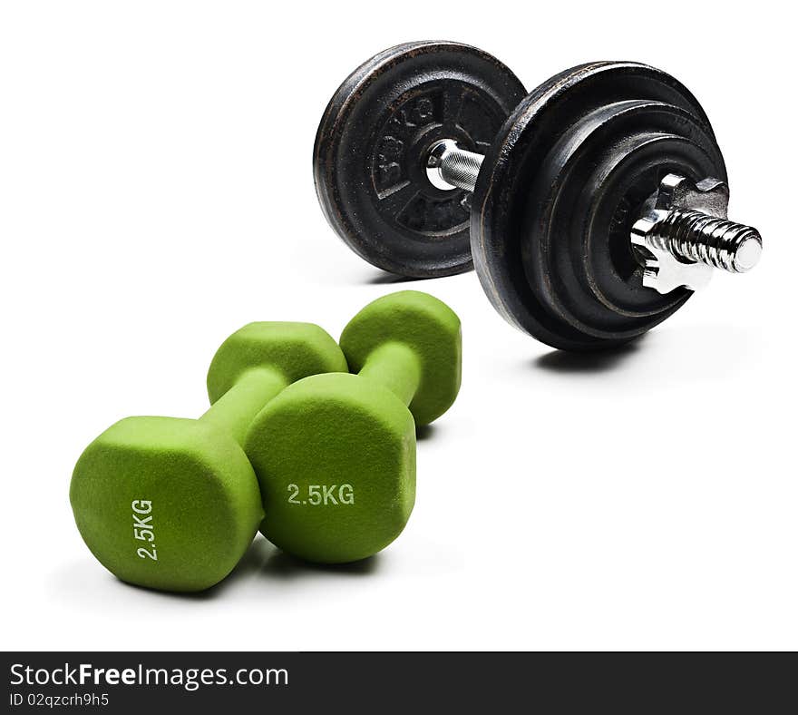 Black and green dumbbells on a white background with space for text