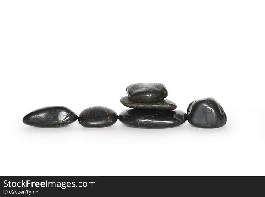 Few black stones isolated on white background with clipping path. Few black stones isolated on white background with clipping path