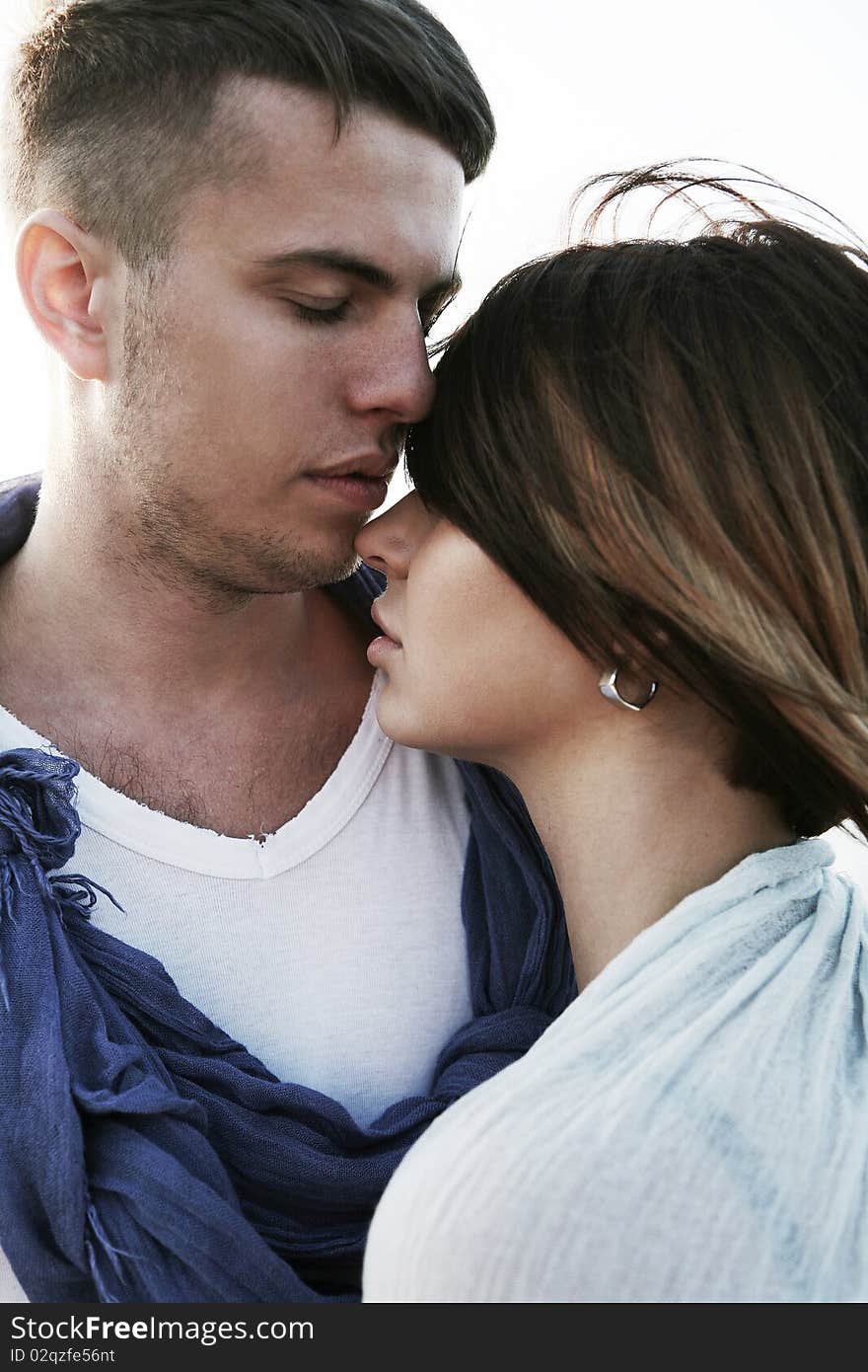 Lovely couple standing on the beach