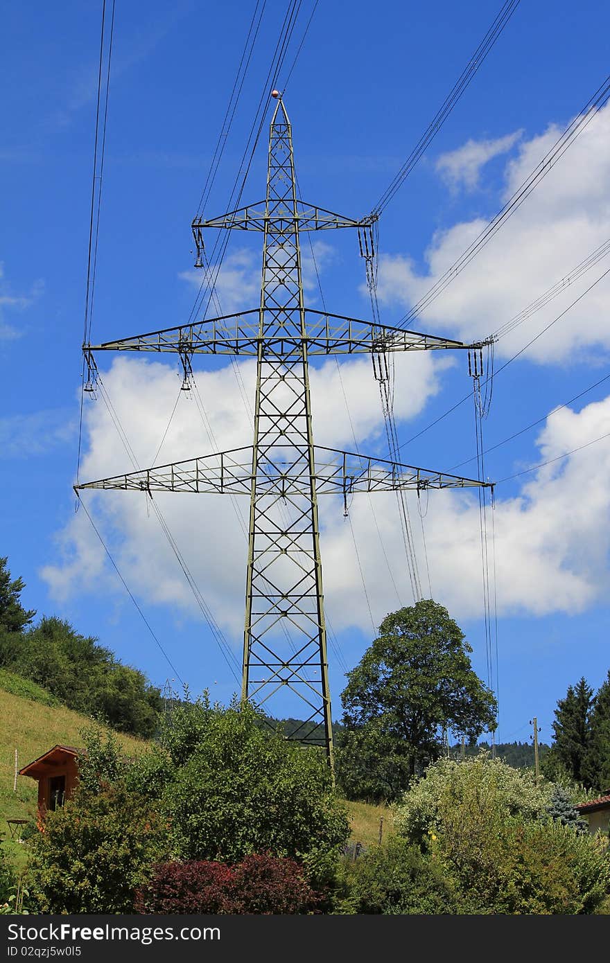 Electrical pilone and trees and sky blue. Electrical pilone and trees and sky blue