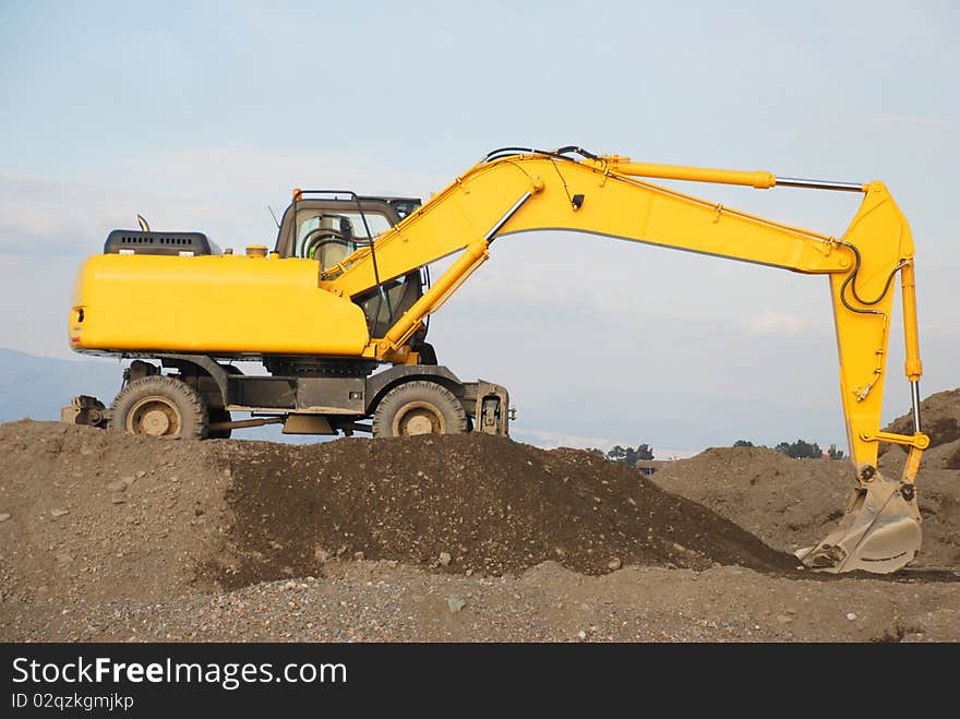 Yellow bulldozer for moving to sand