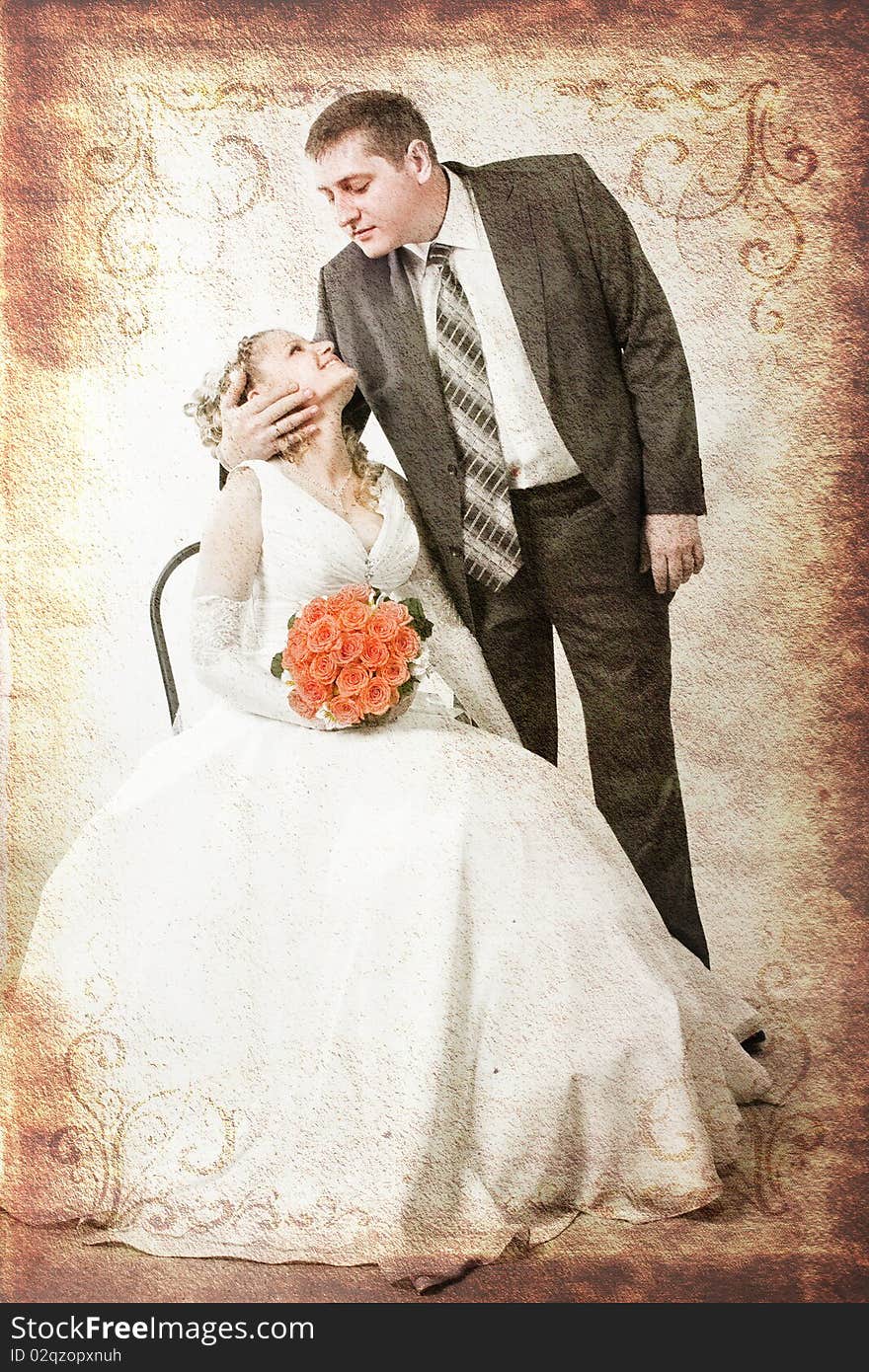 Photography of happy newly-wed is in a studio