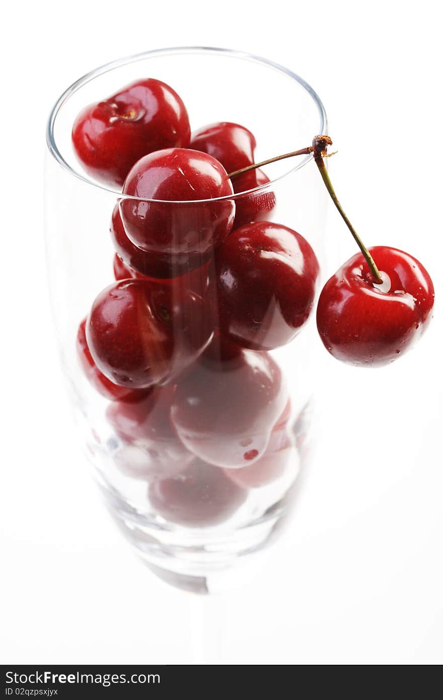 Cherries in a cup  on white background