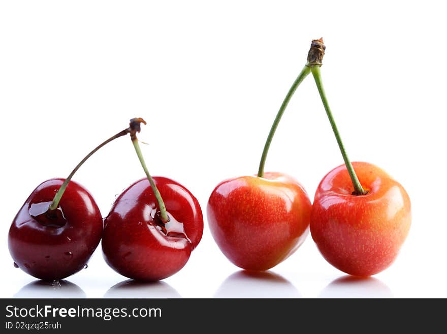 Few cherries on white background