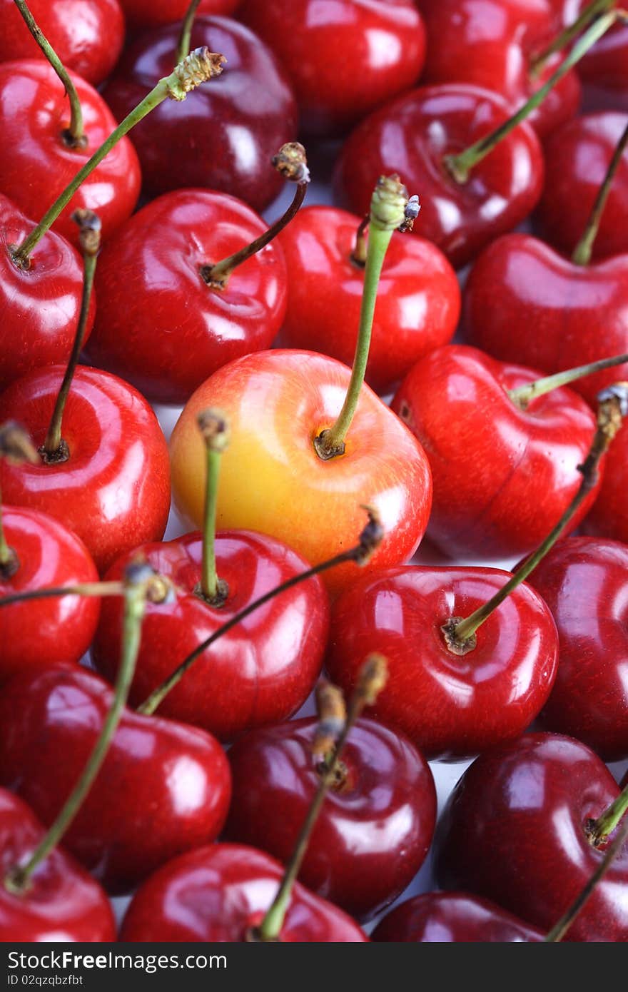 Few cherries on white background