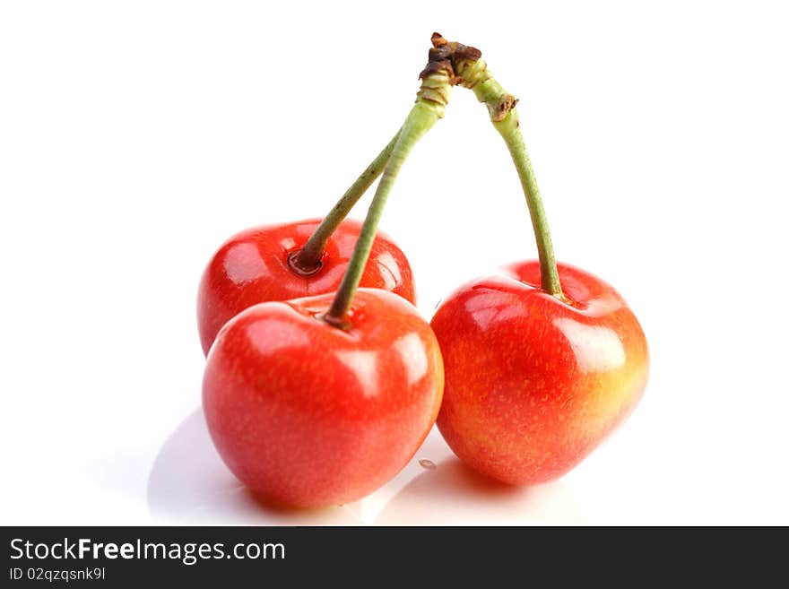 Few cherries on white background