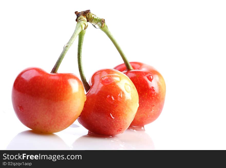 Few cherries on white background