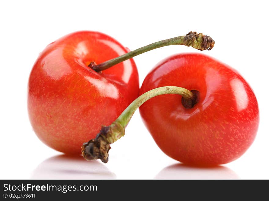 Few cherries on white background