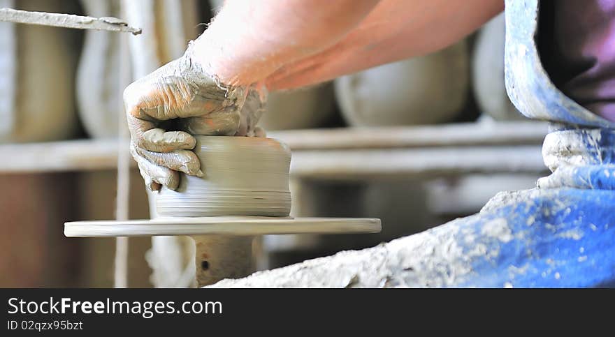 Making of a ceramic vase inside of workshop