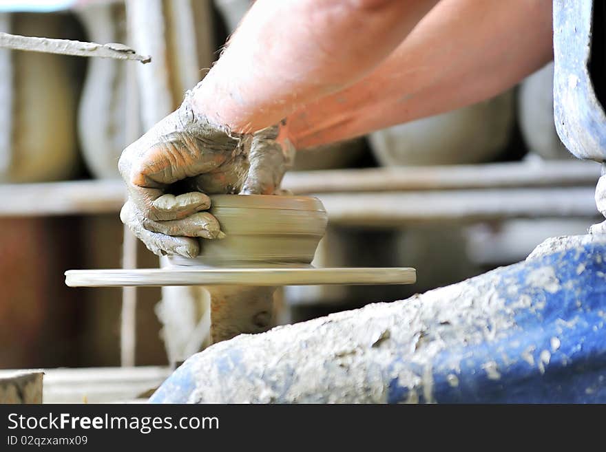 Making of a ceramic vase inside of workshop