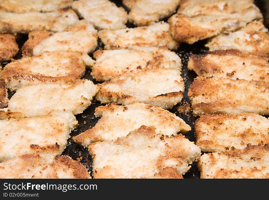 Meat pieces in crackers fried in oven. Meat pieces in crackers fried in oven