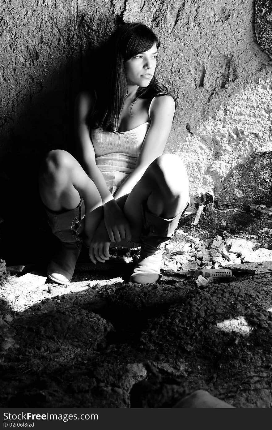 black and white photo with caucasian teenager thinking in demolished building. black and white photo with caucasian teenager thinking in demolished building