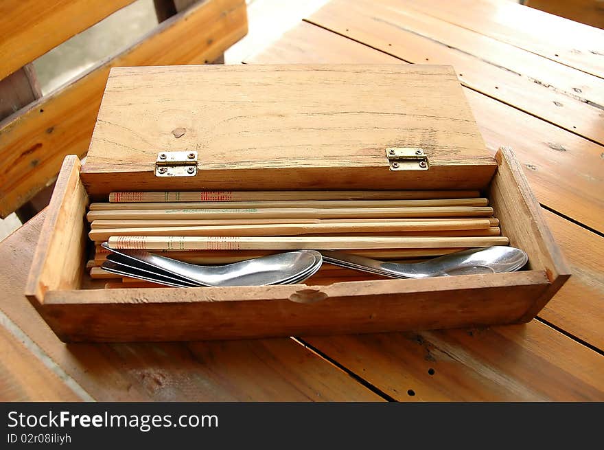 Spoons and Chopsticks in wood box. Spoons and Chopsticks in wood box