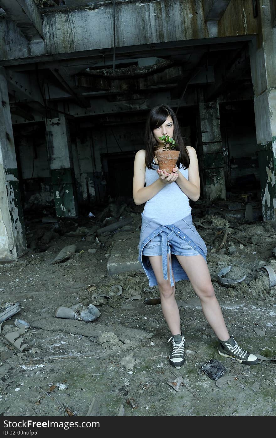 Concerned Teenager Holding Flower Pot