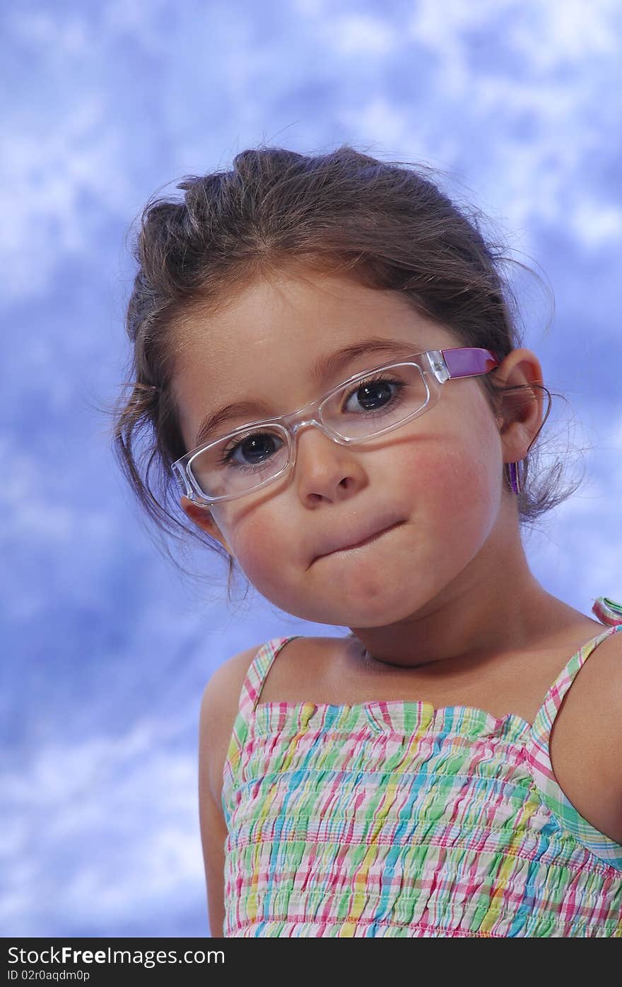 A sweet little girl with glasses