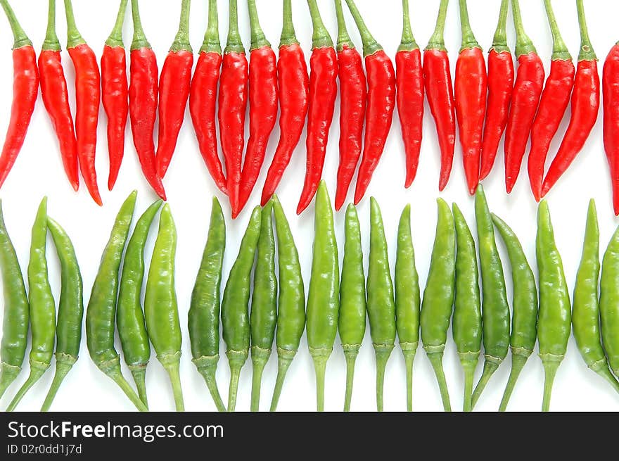 Red and green chili on white background