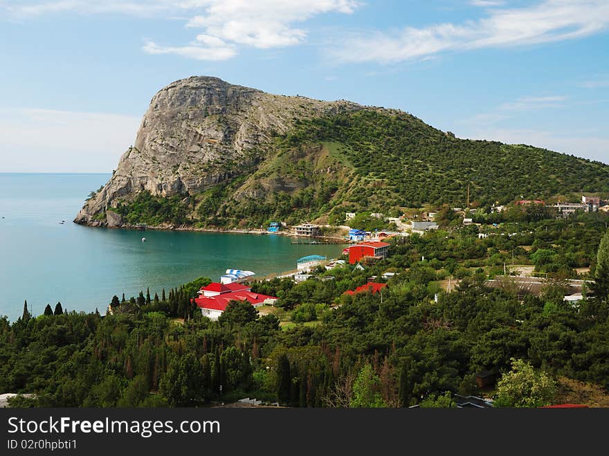 Green bay of Noviy Svet is located between Crimean mountains. It is photographed from the mountain Sokol. Green bay of Noviy Svet is located between Crimean mountains. It is photographed from the mountain Sokol.