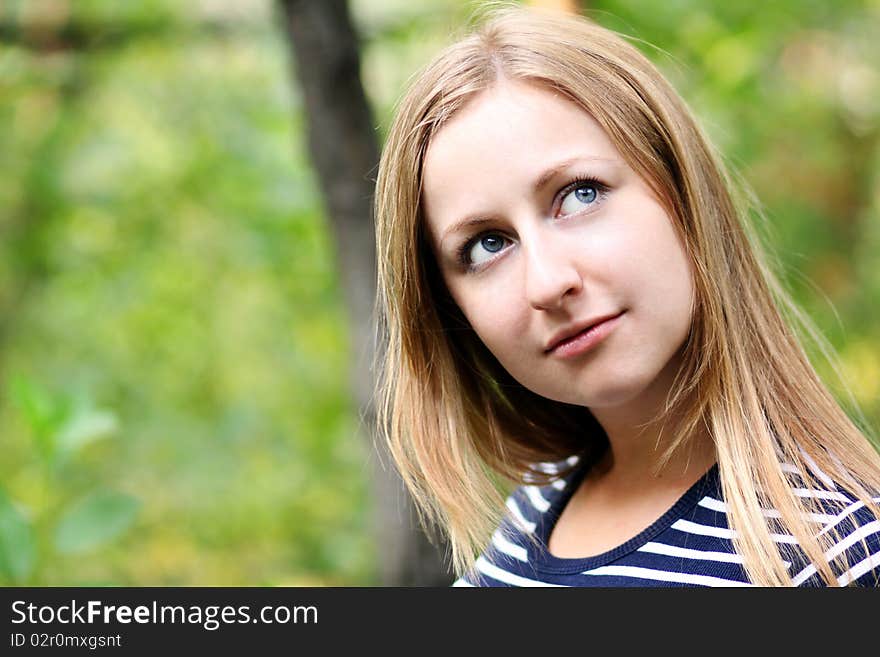 Beautiful young girl smiling. Outdoor portrait