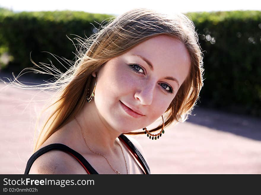 Beautiful young girl smiling. Outdoor portrait