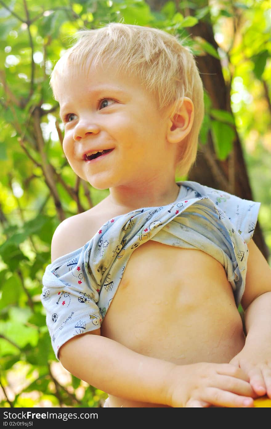 Smiling handsome boy on a green background