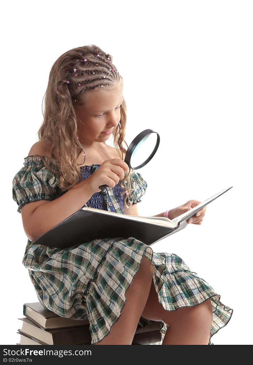 Little girl holding magnifying glass, isolated on white background