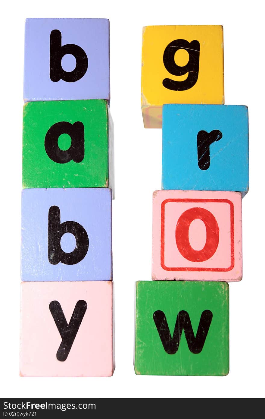 Assorted childrens toy letter building blocks against a white background that spell baby grow with clipping path. Assorted childrens toy letter building blocks against a white background that spell baby grow with clipping path