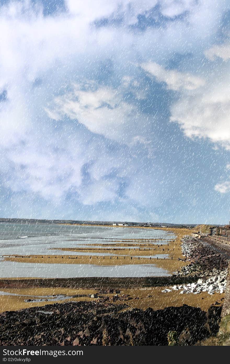 Beach during a rain storm on the rocks in youghal county cork ireland