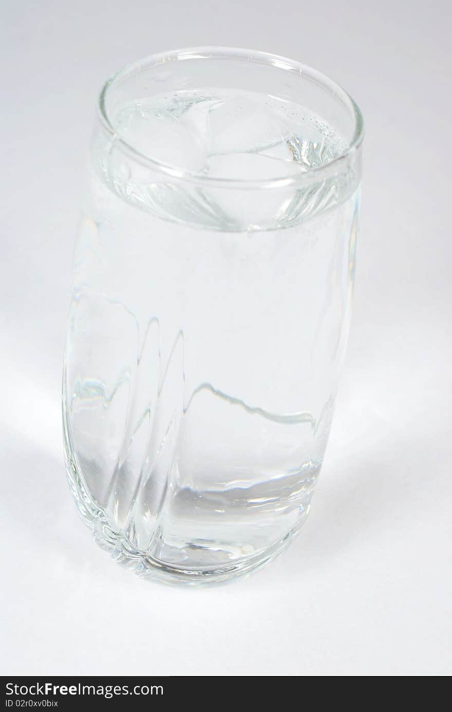 Glass of water on grey background