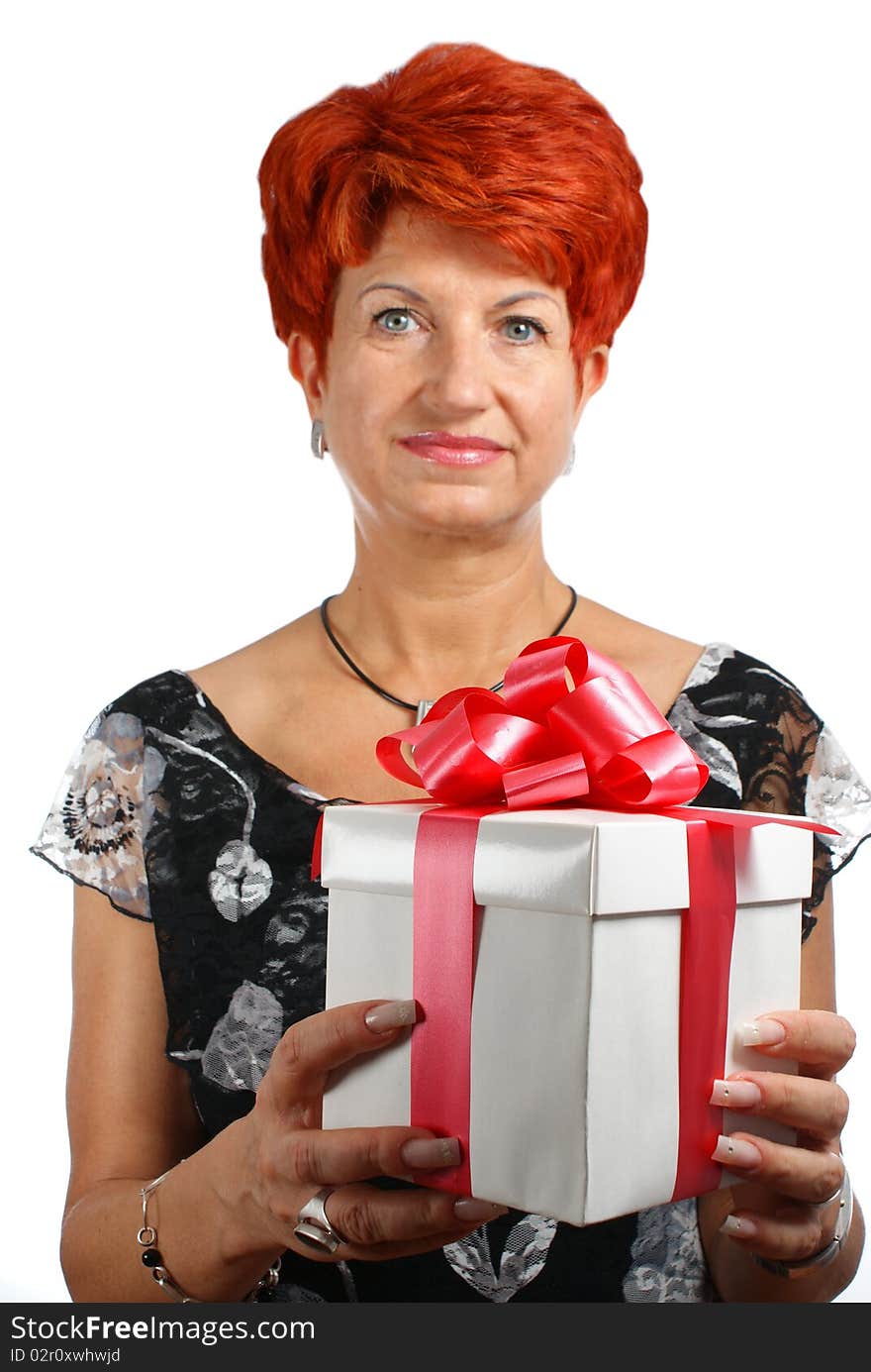 Mature woman with gift box isolated on white