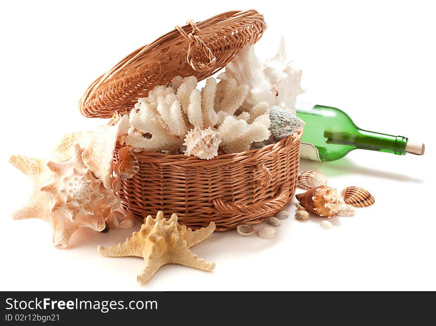 Marine souvenirs in a basket and a bottle with a message