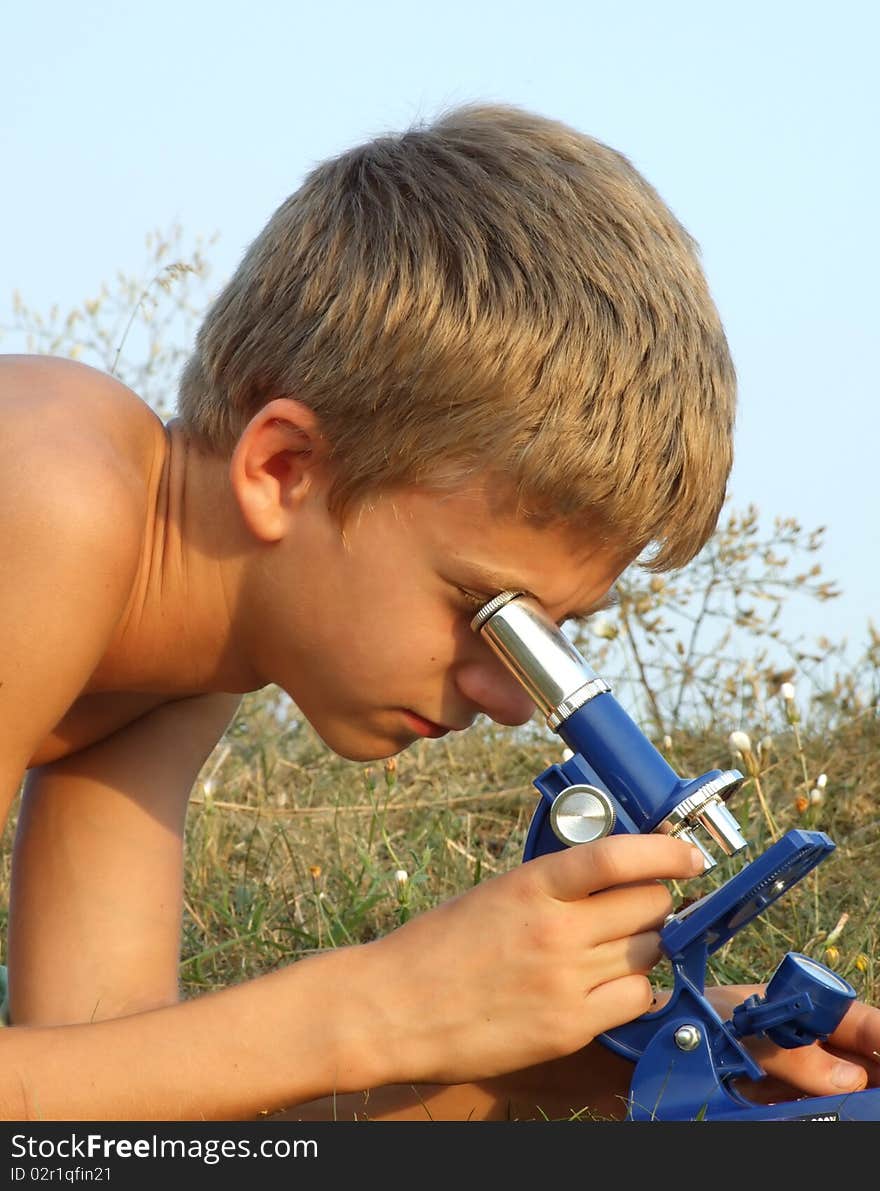 Boy and microscope