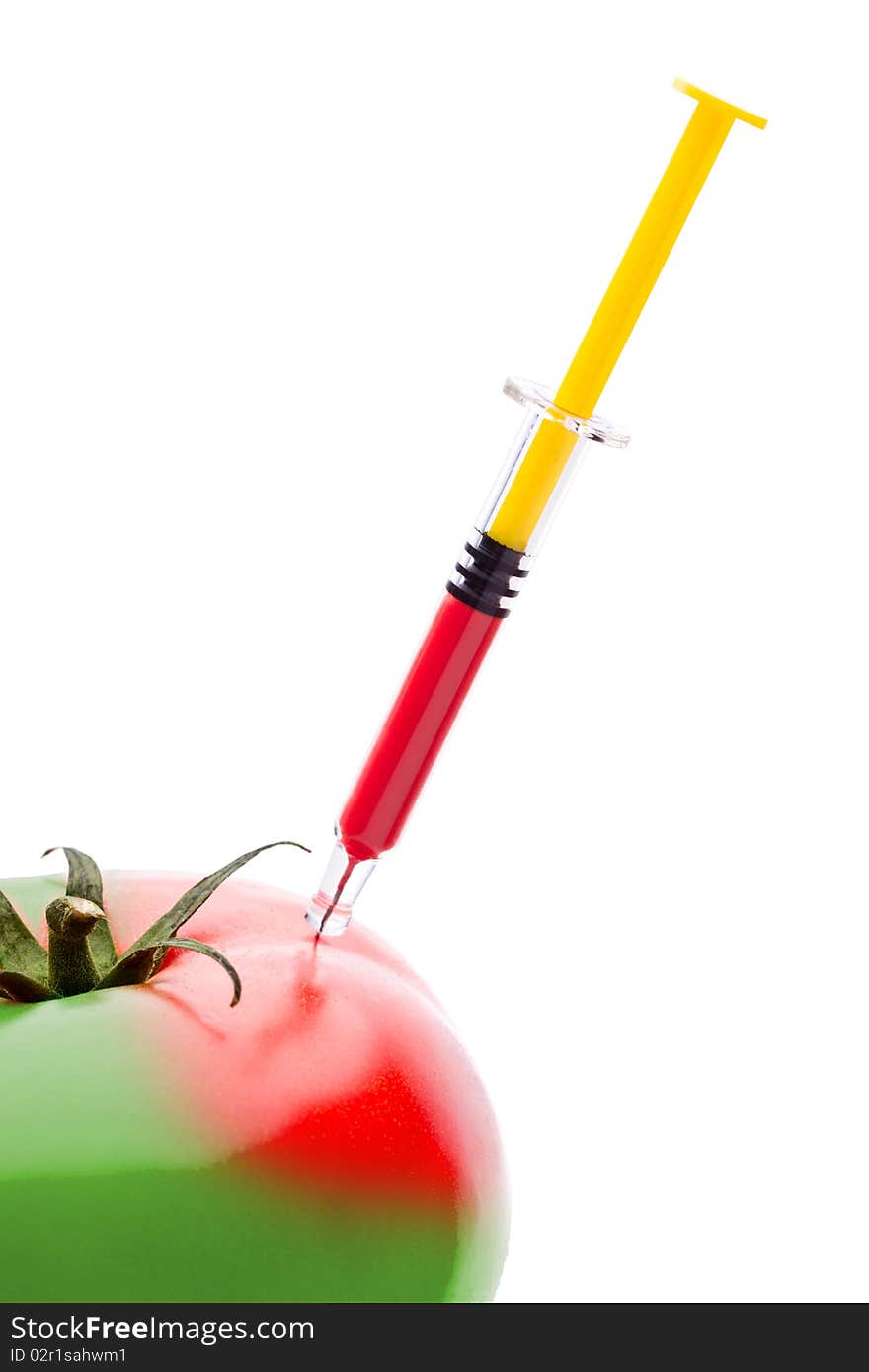 Injecting red liquid in big tomato. Useful for genetic modification concepts. Injecting red liquid in big tomato. Useful for genetic modification concepts.