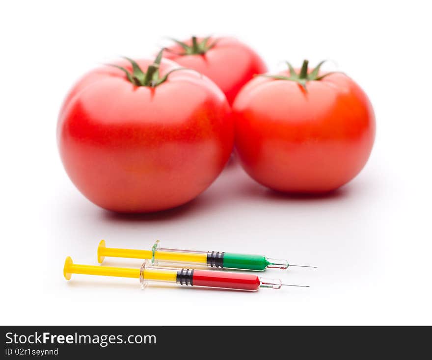 Syringe Red nad Green Liquid with Tomatoes