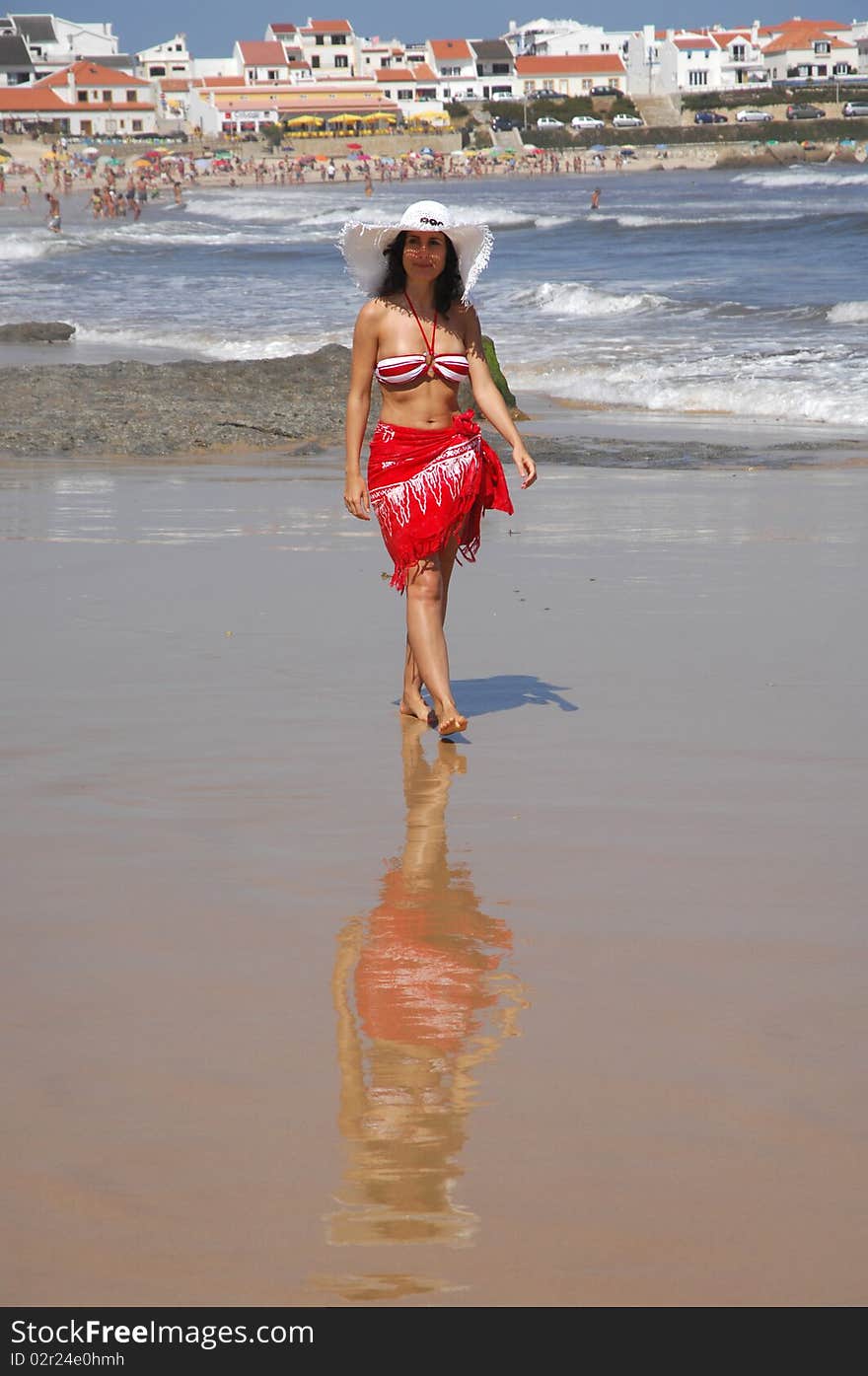 Beautiful girl walking on the beach