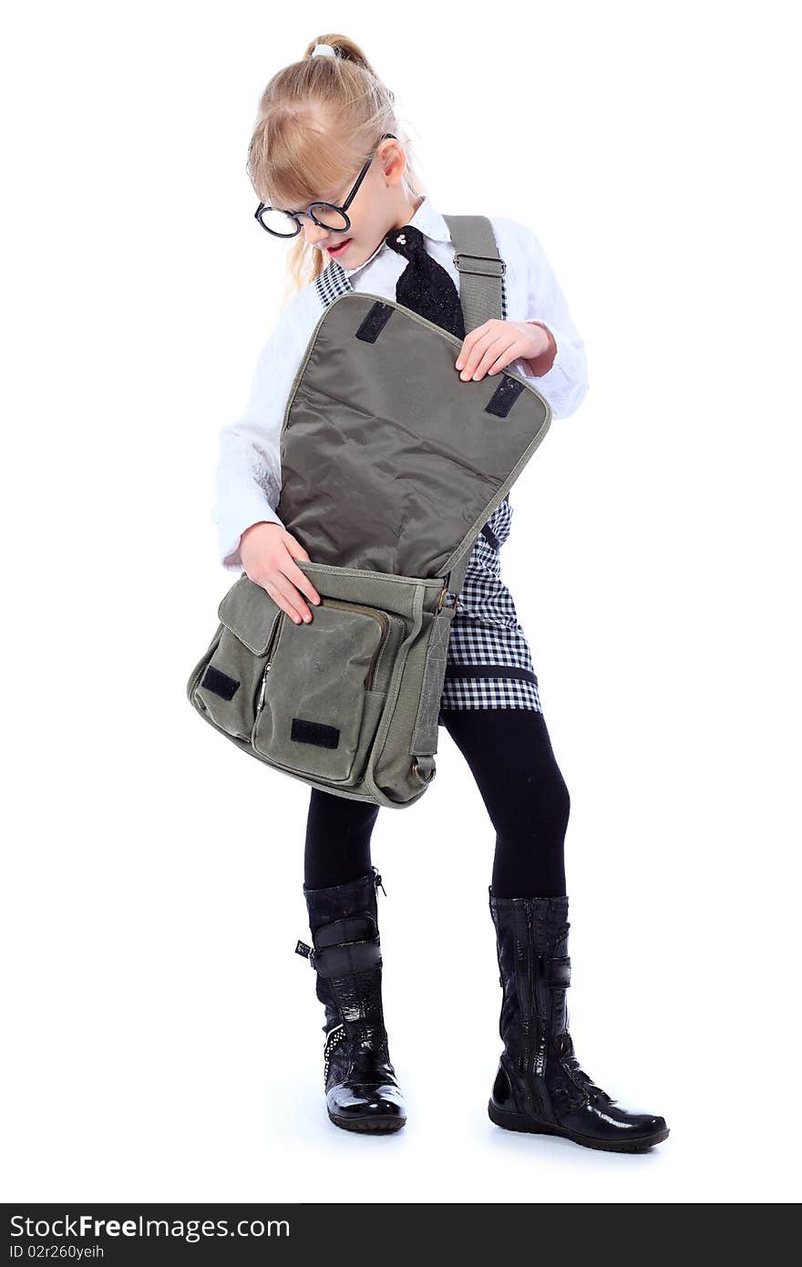 Shot of a little schoolgirl in glasses posing with her bag. Isolated over white background.