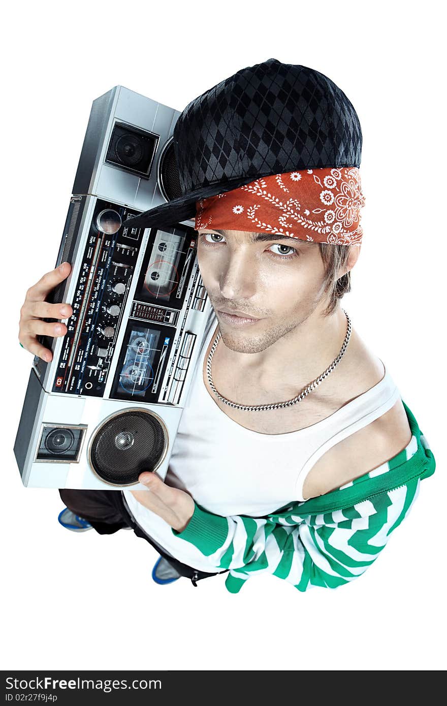 Trendy young man posing with tape recorder. Trendy young man posing with tape recorder.