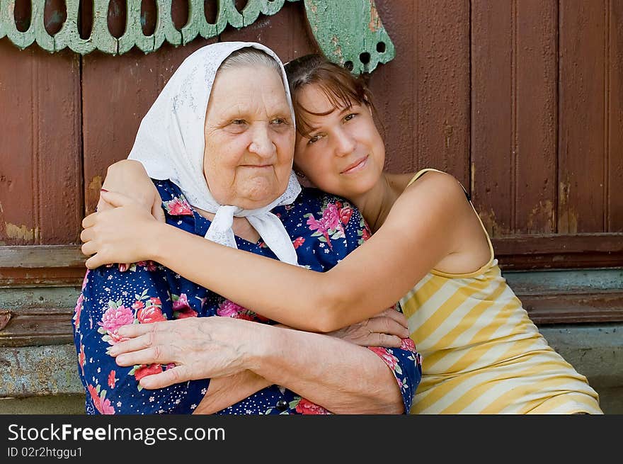 Grandmother and granddaughter embraced and happy outdoor