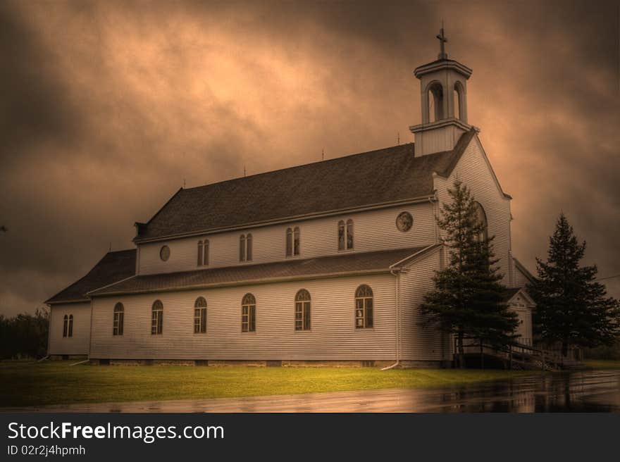 This is an HDR image of an old, wooden Roman Catholic church in a small town called Adamsville, located near Moncton New Brunswick. This is an HDR image of an old, wooden Roman Catholic church in a small town called Adamsville, located near Moncton New Brunswick.